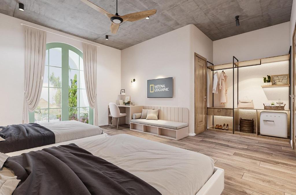 Postel nebo postele na pokoji v ubytování Hoi An Pinus Boutique