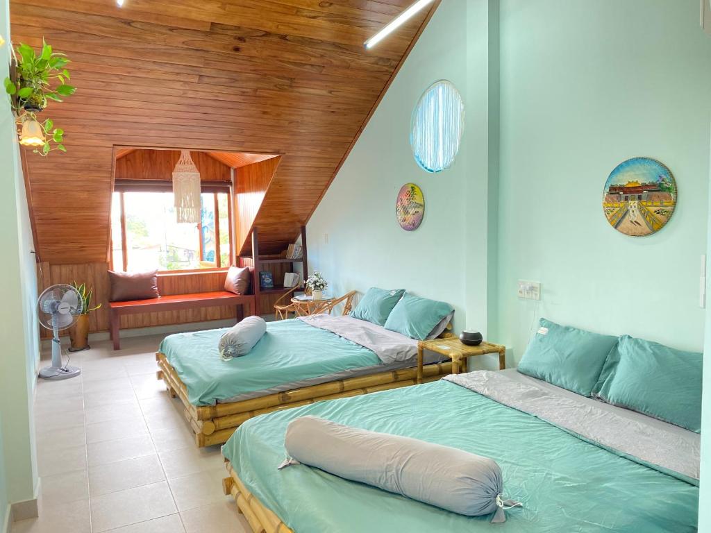 Postel nebo postele na pokoji v ubytování Tâm Family Homestay-Huế