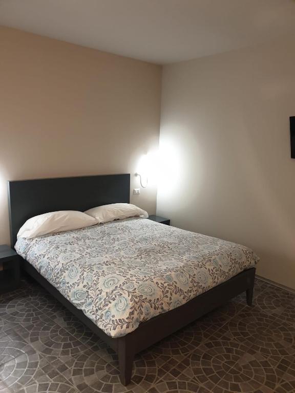 Postel nebo postele na pokoji v ubytování Piccolo Hotel Olina