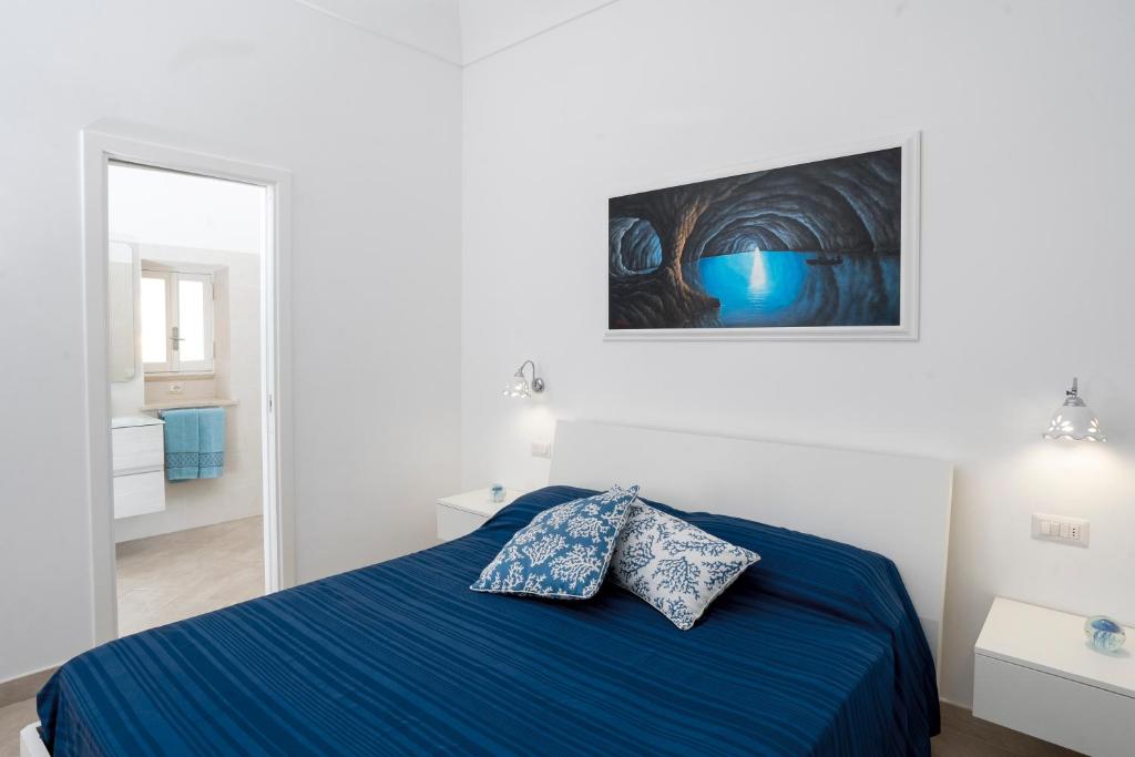 Postel nebo postele na pokoji v ubytování Caprita Guest House