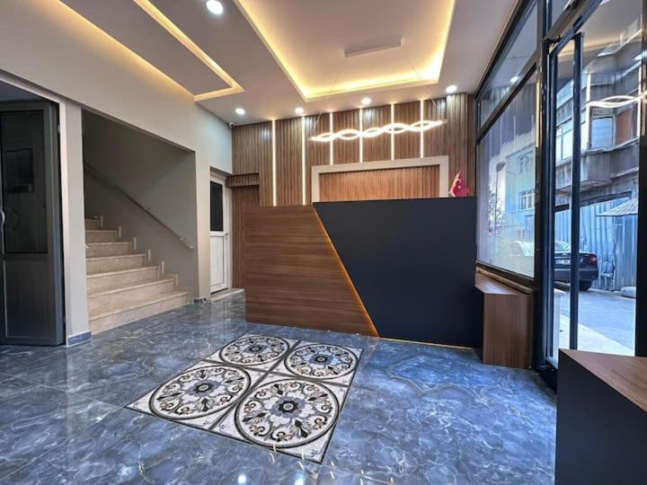 a room with a lobby with a floor with a rug at HOTEL KOCABASOGLU in Istanbul