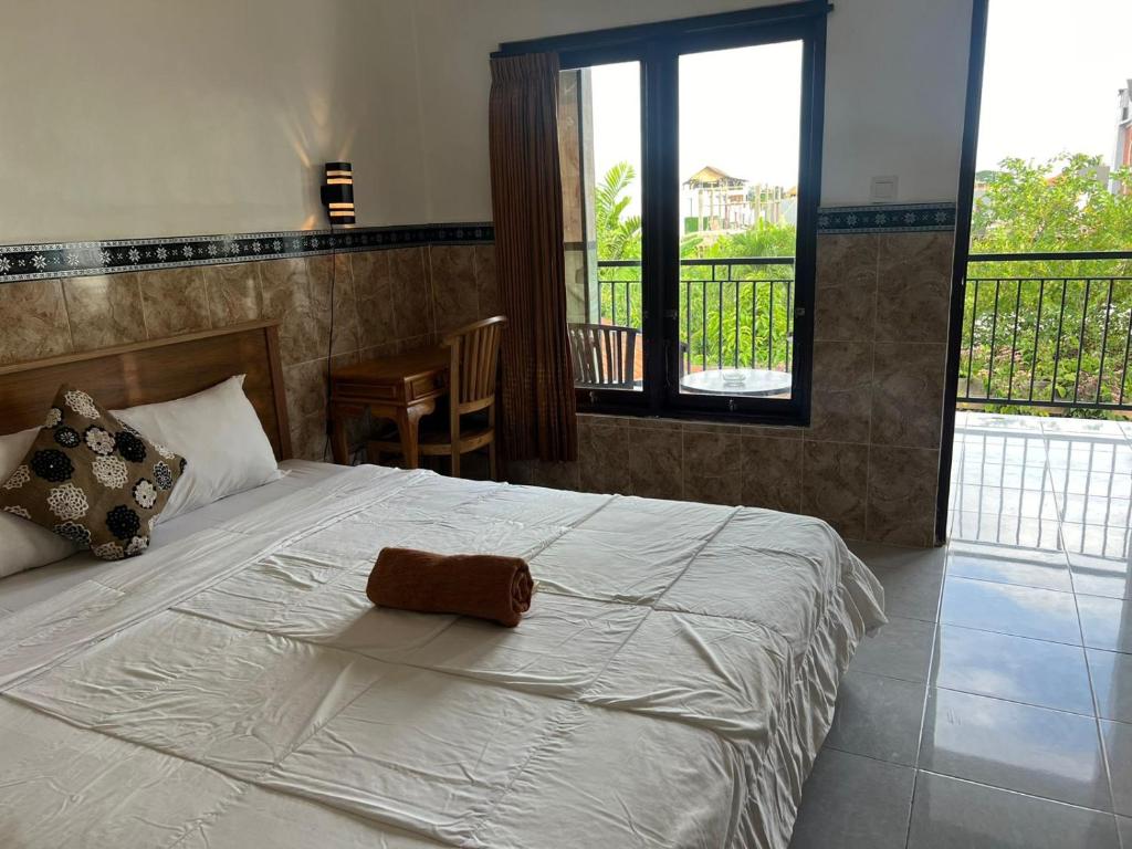 Postel nebo postele na pokoji v ubytování Leo Home Stay