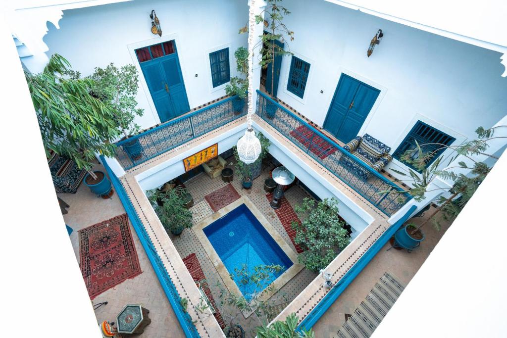 an overhead view of a building with a swimming pool at Riad Azalia in Marrakesh