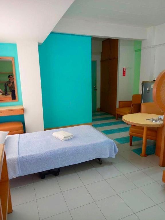 Postel nebo postele na pokoji v ubytování Mansion Sarasinee @ Chatuchak