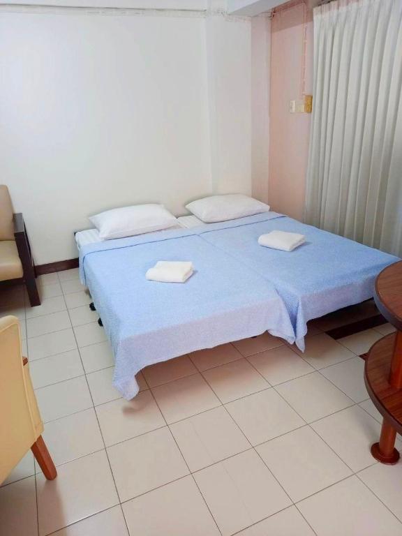 Postel nebo postele na pokoji v ubytování Mansion Sarasinee @ Chatuchak