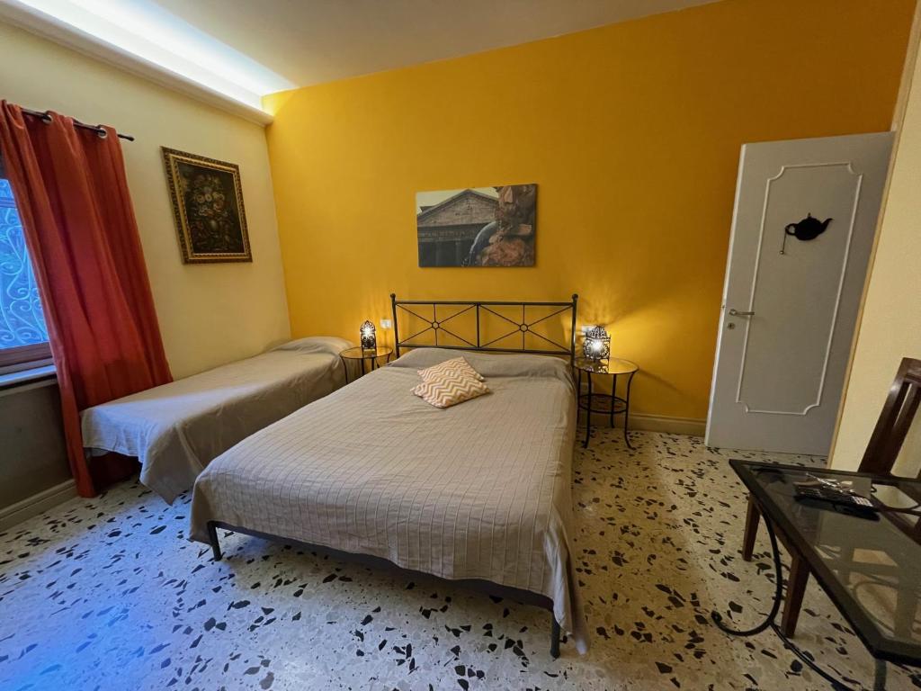Posteľ alebo postele v izbe v ubytovaní B&B Tiburtina Garden