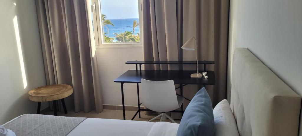 Postel nebo postele na pokoji v ubytování Sabbia Suites Blue