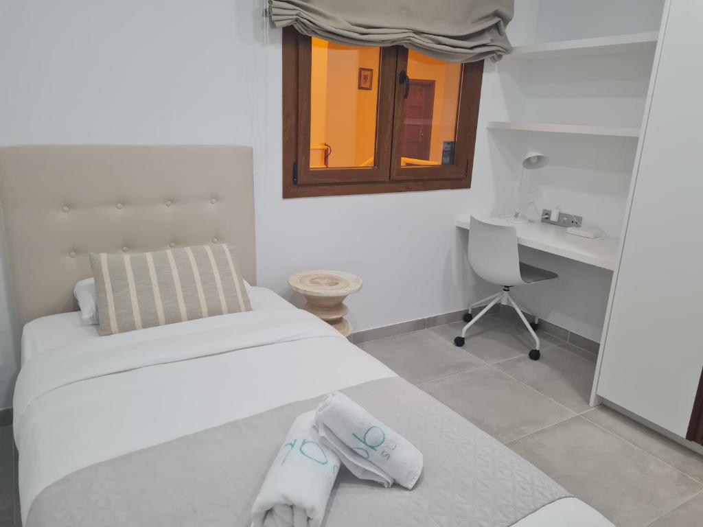 Postel nebo postele na pokoji v ubytování Sabbia Suites Blue
