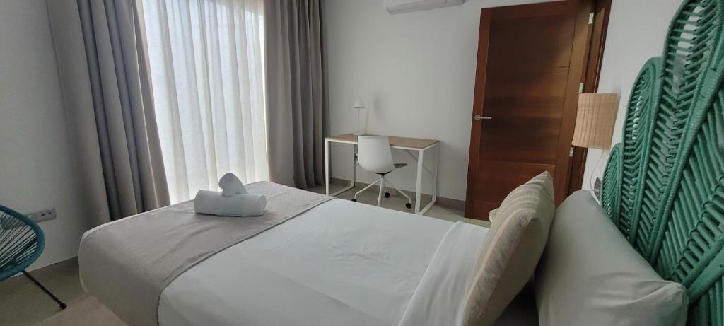 Postel nebo postele na pokoji v ubytování Sabbia Suites Blue