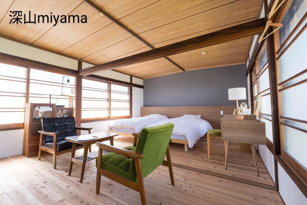 Postel nebo postele na pokoji v ubytování 深山邸miyama-tei