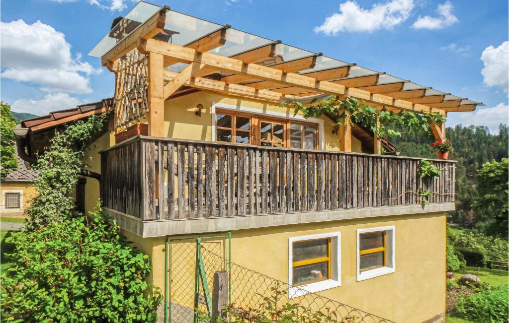 a house with a deck on top of it at Nice Home In Klein St, Paul With Kitchen in Eberstein