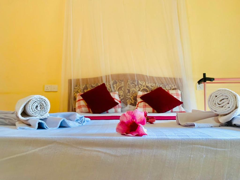 Postel nebo postele na pokoji v ubytování Sinhagiri Villa