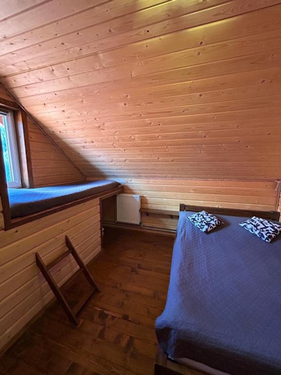 Postel nebo postele na pokoji v ubytování Guest House Kaspiy