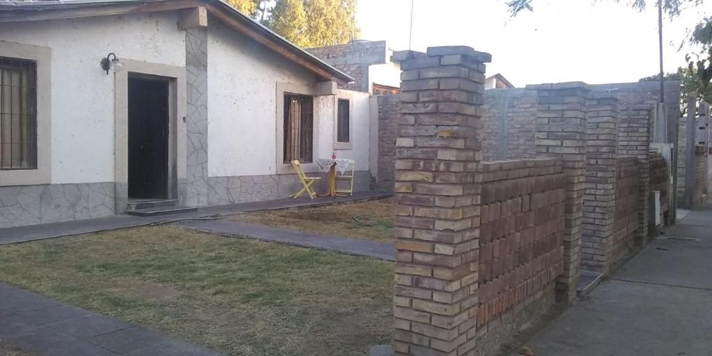 a brick wall in front of a house at CASA CONFORT in Corralitos