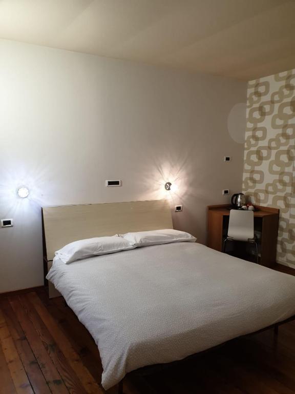 Postel nebo postele na pokoji v ubytování Piccolo Hotel Olina