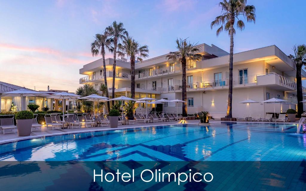 a large swimming pool in front of a hotel at Hotel Olimpico in Pontecagnano