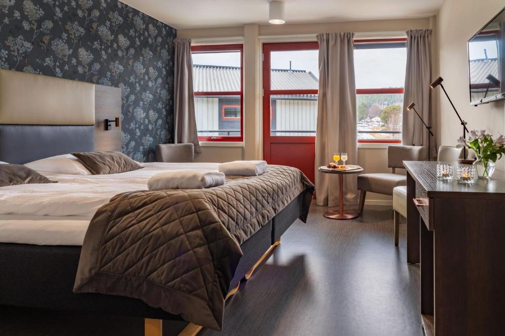 En eller flere senge i et værelse på Milepelen Hotel & Vertshus