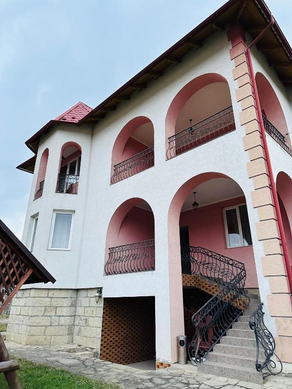 a building with balconies and stairs on it at VerhoVilla in Verkhovyna