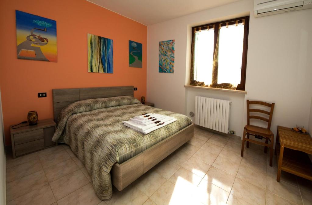 A bed or beds in a room at Le Palme Sona
