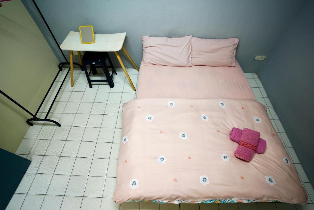 Postel nebo postele na pokoji v ubytování Swanling Kuching