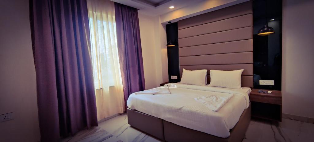 Postel nebo postele na pokoji v ubytování PK Boutique Hotel