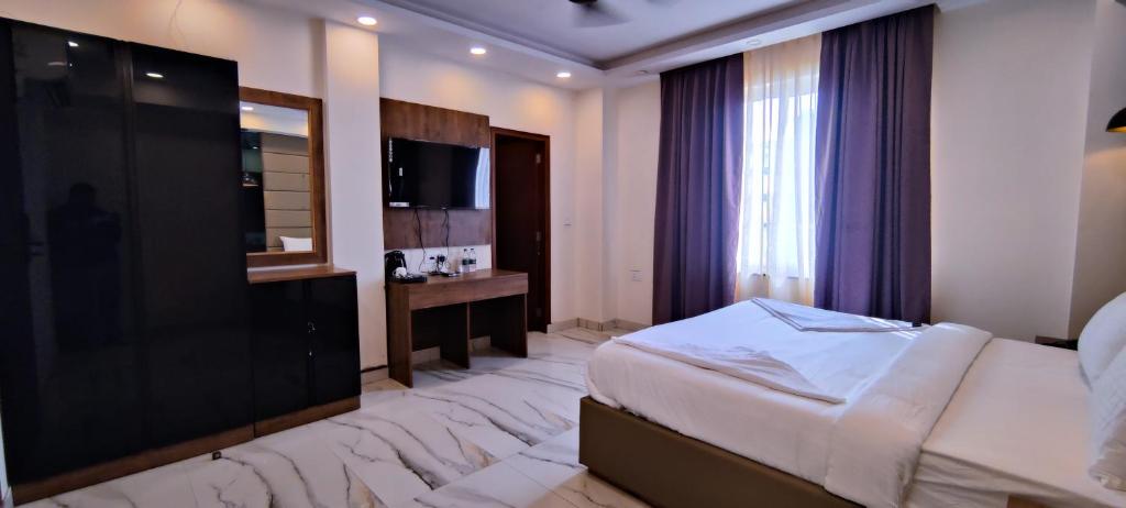 Postel nebo postele na pokoji v ubytování PK Boutique Hotel