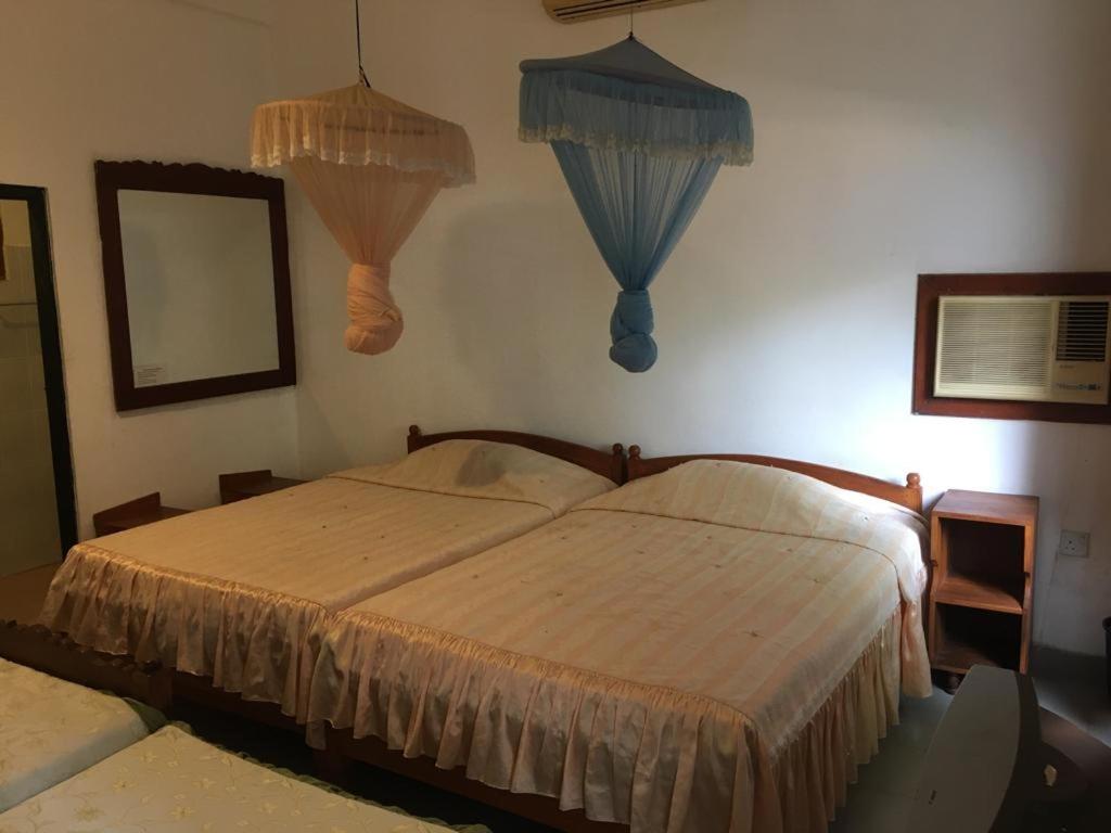 Postel nebo postele na pokoji v ubytování Hotel Shalini