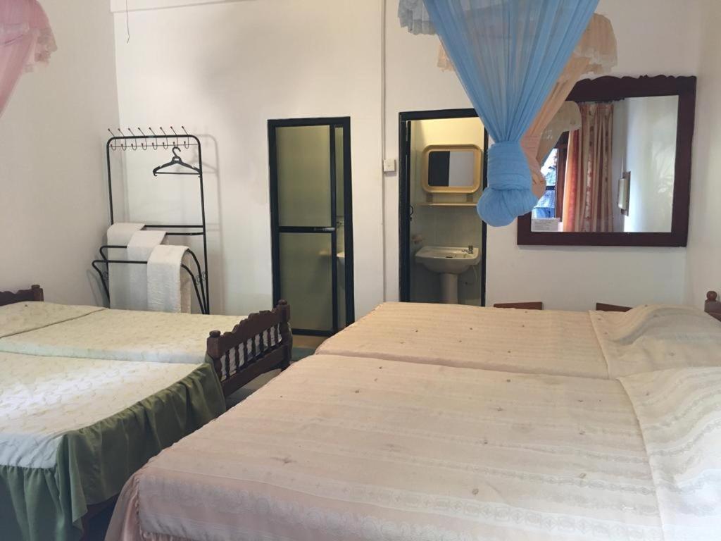 Postel nebo postele na pokoji v ubytování Hotel Shalini