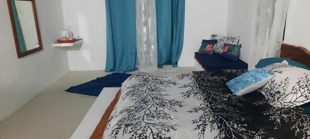 Postel nebo postele na pokoji v ubytování Le lataniers