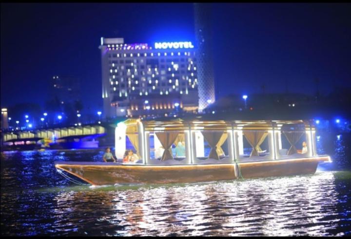 a boat in the water with people on it at Nile Boat in Cairo
