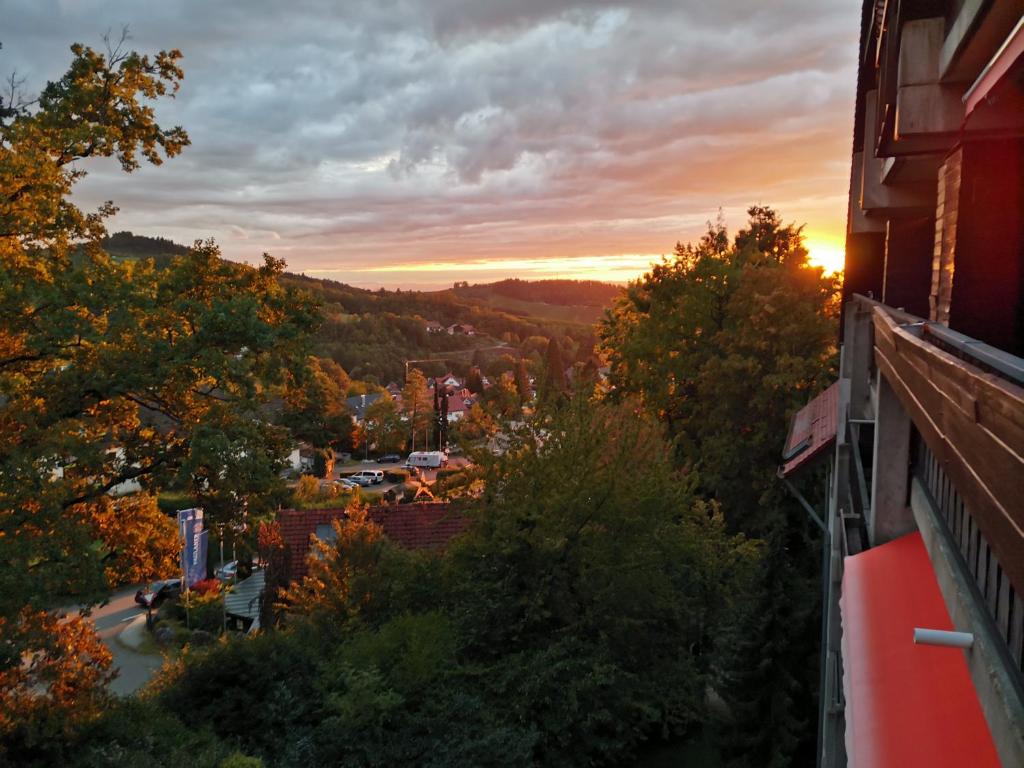 a view of a city at sunset from a building at Gaishöll-Wasserfälle Apartment Schwarzwald in Sasbachwalden