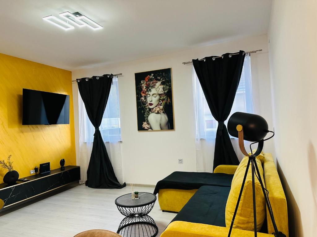 a bedroom with a bed and a tv in it at Apartman Jovičić in Bjelovar