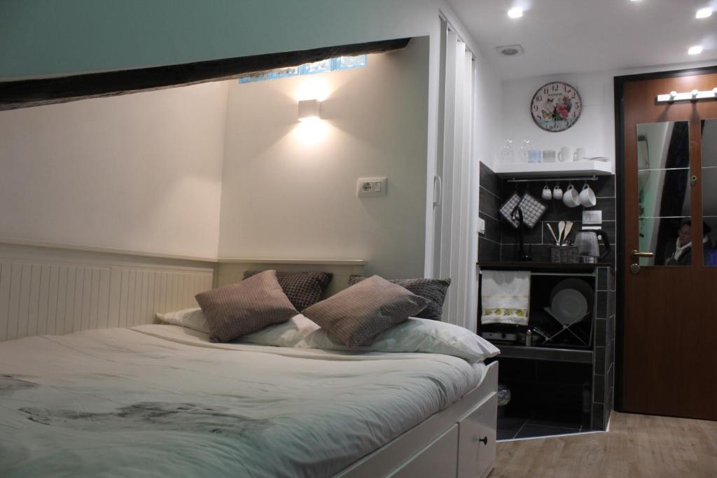 a bedroom with a large bed with pillows on it at La Piccola Mole - Turin Cozy Apartment in Turin