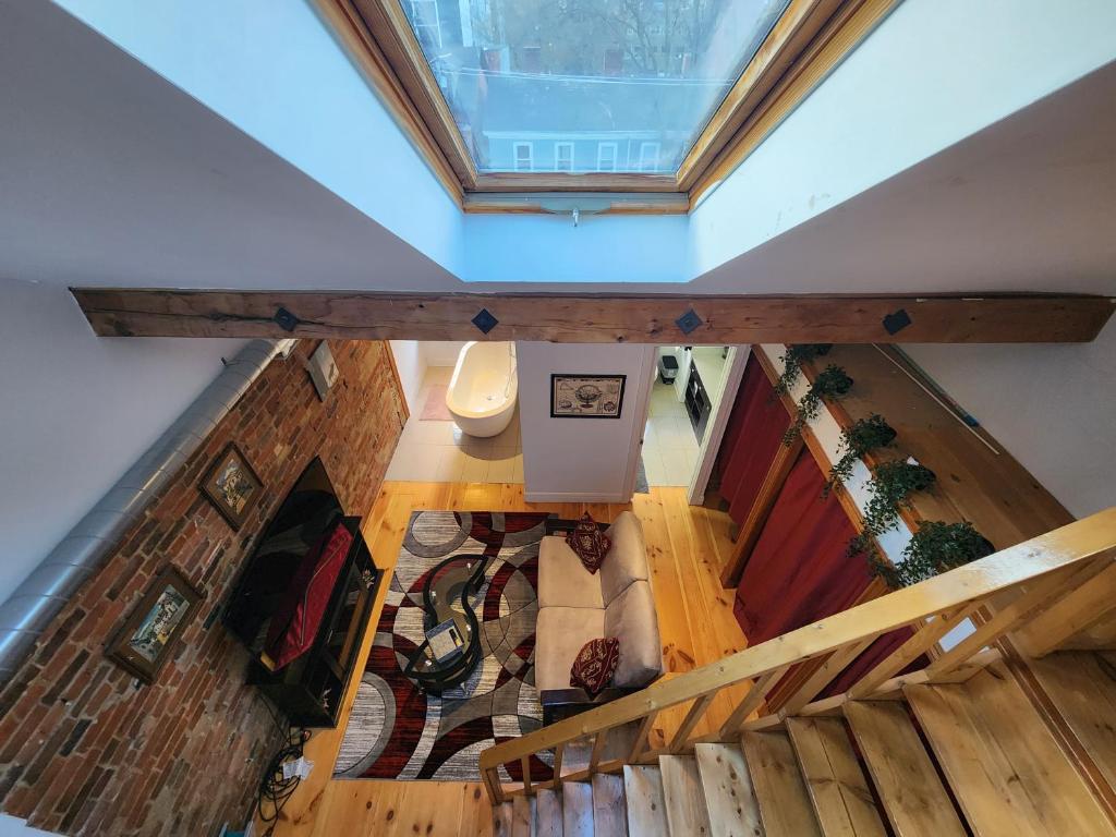 an overhead view of a living room with a ceiling at Downtown Toronto Townhouse in Toronto