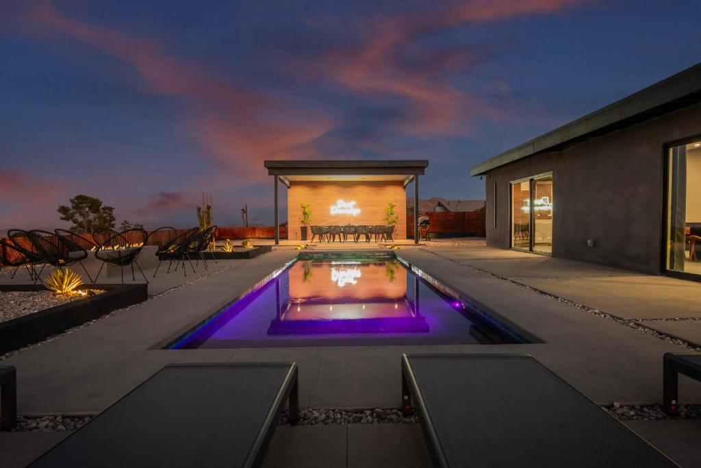 a swimming pool in the middle of a house at Desert Dreamscape in Joshua Tree
