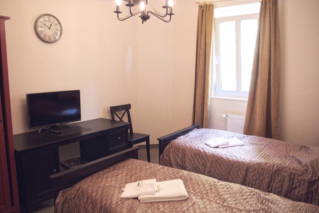 Postel nebo postele na pokoji v ubytování Hotel St.Michael