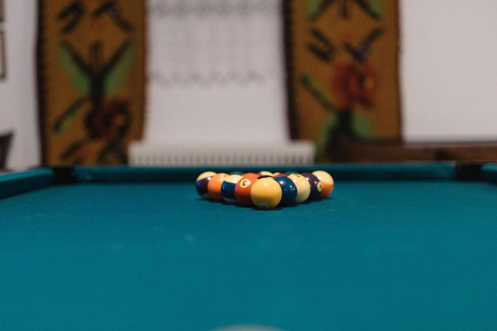 a pair of pool balls on a pool table at Billiard Home in Trikala in Tríkala