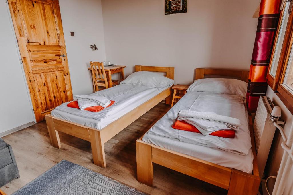 Postel nebo postele na pokoji v ubytování BILÍKOVA CHATA - Horský hotel