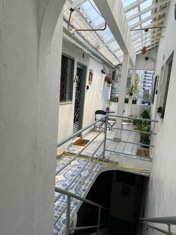 an empty hallway of a building with a balcony at Luso Apartamentos in Manaus
