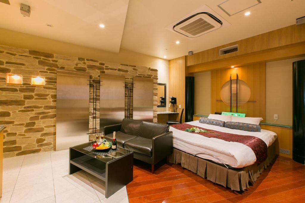 Ein Bett oder Betten in einem Zimmer der Unterkunft Hotel AXIS -アクシス-