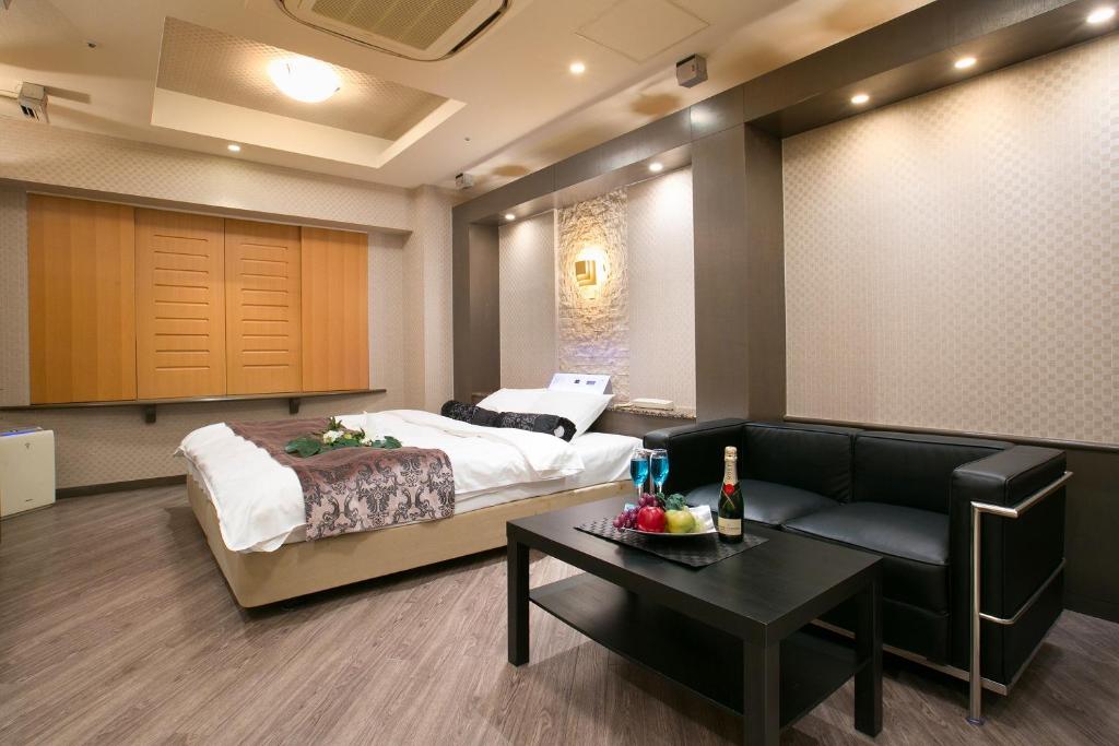 Ein Bett oder Betten in einem Zimmer der Unterkunft Hotel AXIS -アクシス-