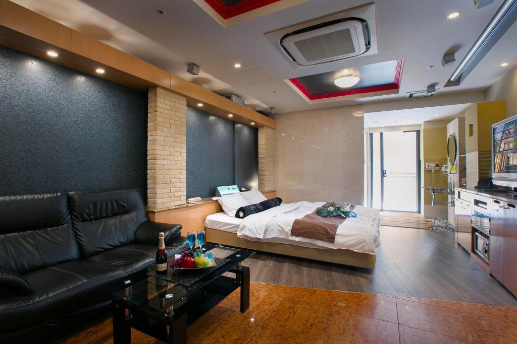 Ein Bett oder Betten in einem Zimmer der Unterkunft Hotel AXIS -アクシス-