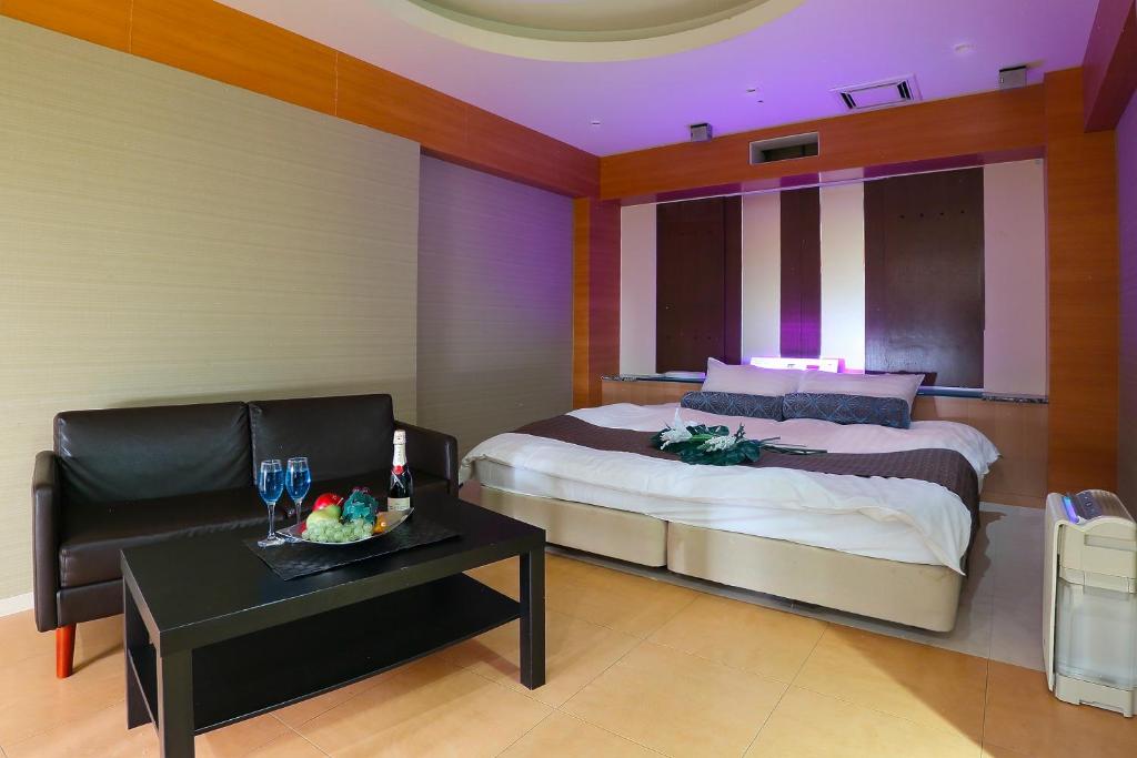 Ein Bett oder Betten in einem Zimmer der Unterkunft Hotel AXIS -アクシス-