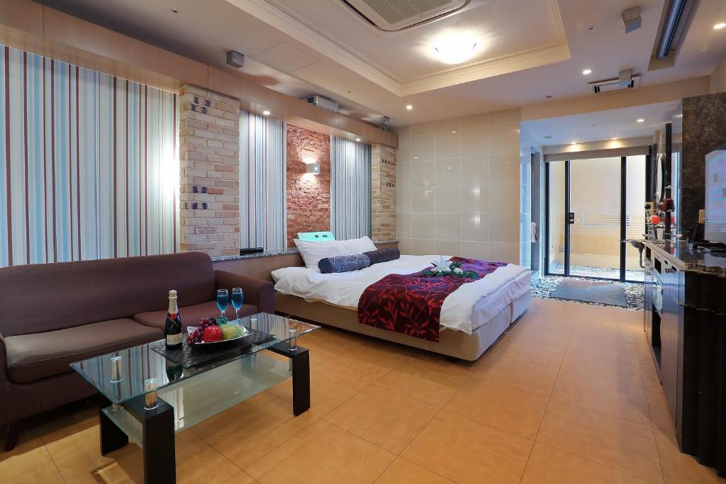 Ein Bett oder Betten in einem Zimmer der Unterkunft Hotel AXIS -アクシス-