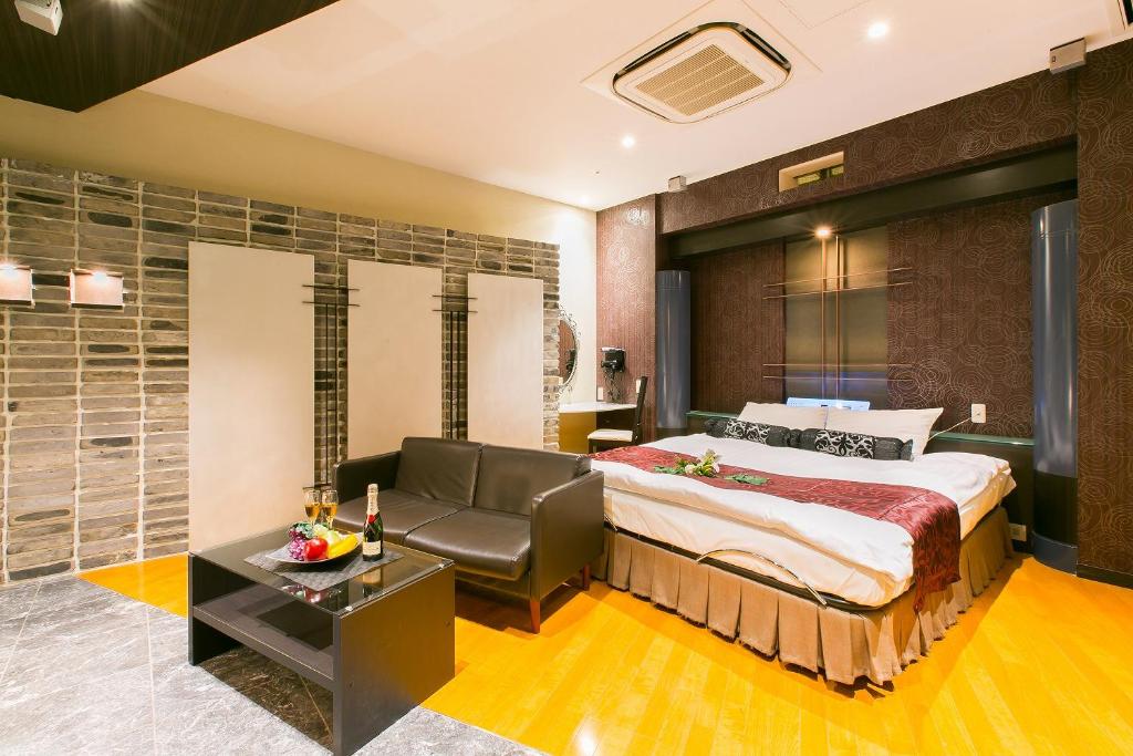 Ein Bett oder Betten in einem Zimmer der Unterkunft Hotel AXIS -アクシス-