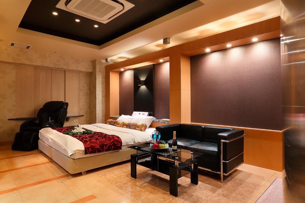 Ein Bett oder Betten in einem Zimmer der Unterkunft Hotel AXIS -アクシス-