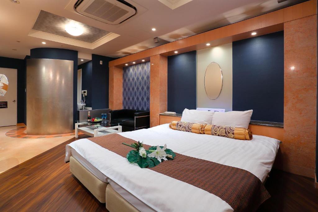 Ein Bett oder Betten in einem Zimmer der Unterkunft Hotel AXIS -アクシス-