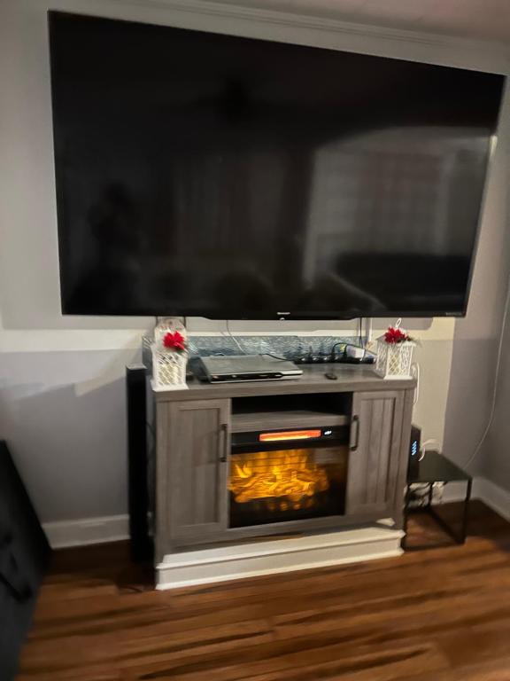 a fireplace with a tv on top of it at Lovely House in Atlantic City Weekly Deal in Atlantic City