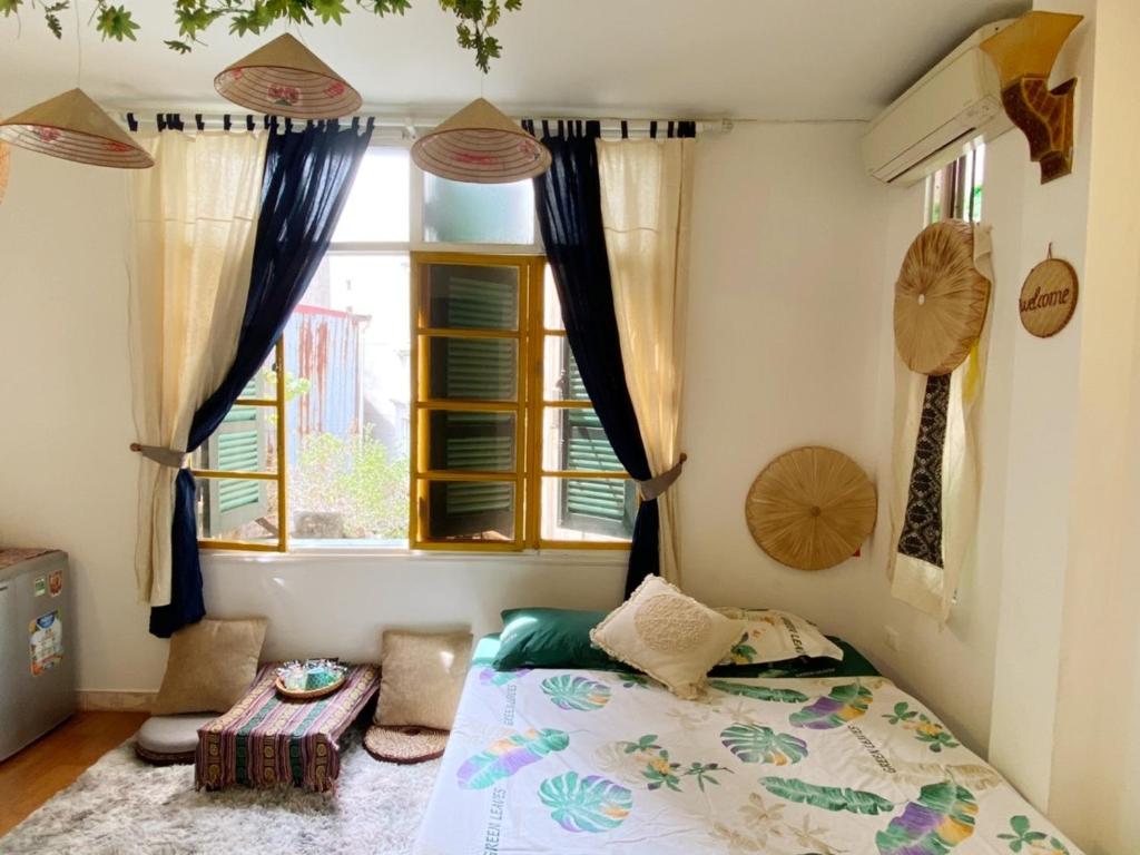a bedroom with a bed and a window at Luna Old Quarter Homestay room #3 in Hanoi