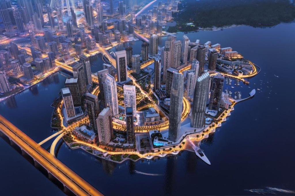 an aerial view of a city at night at Dubai careek Harbour in Dubai